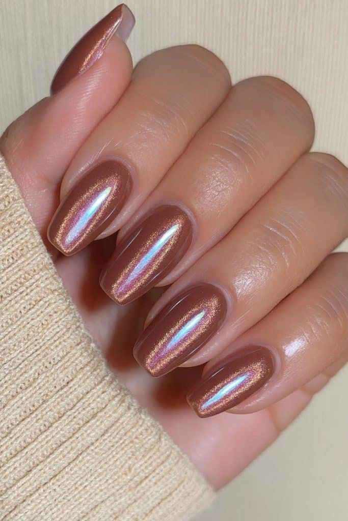 Short squoval nails in rich mocha velvet with warm brown magnetic shimmer.