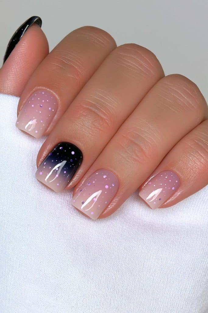Short mystic halloween ombre nails with contrasting polka dot details.