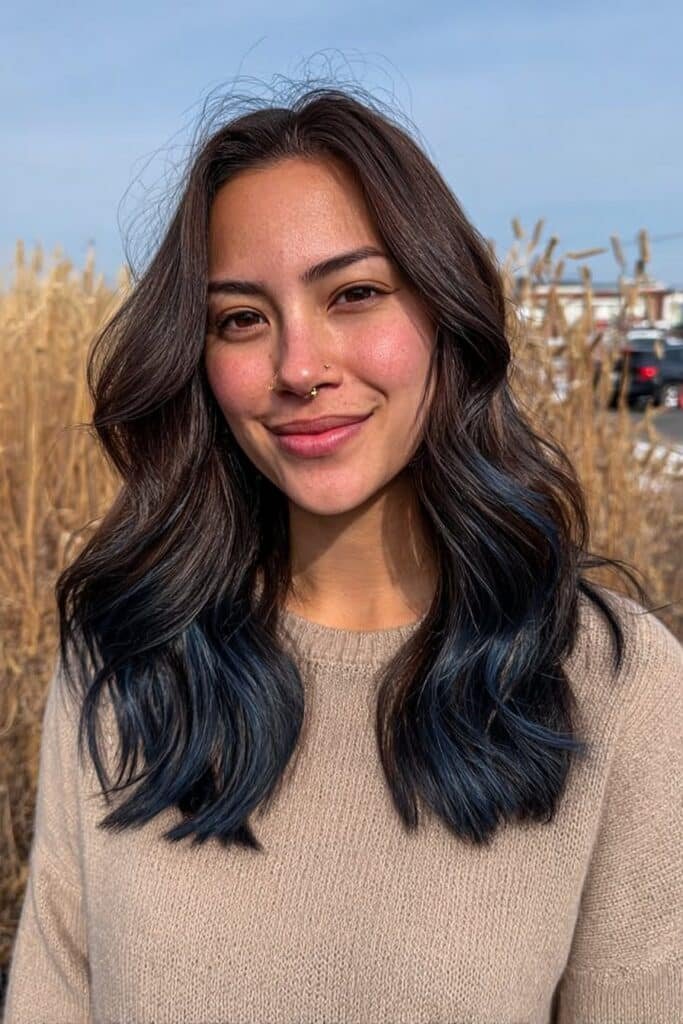 Medium close-up portrait showcasing long dark brown hair with dimensional navy balayage