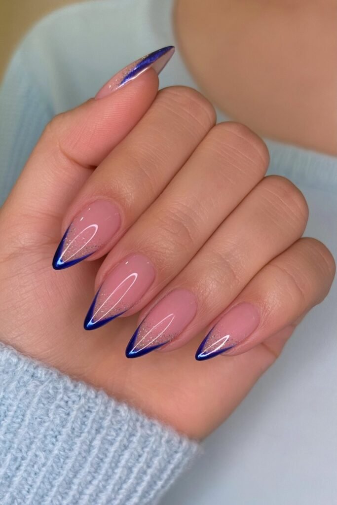 Nude nails with navy chrome pencil-inspired tips.