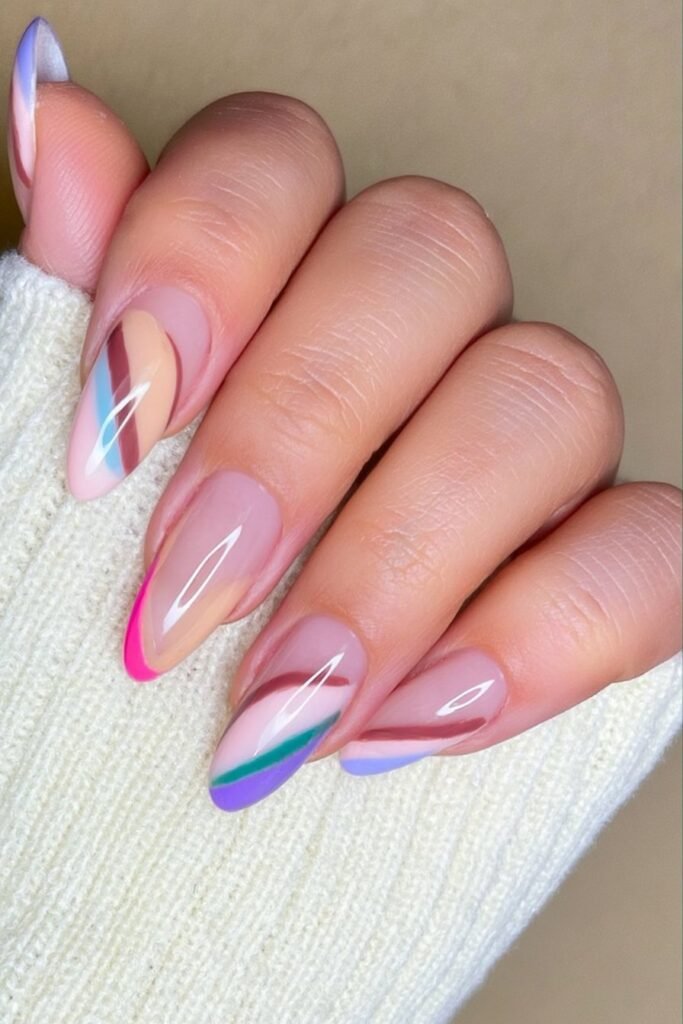 Almond nails with negative space and chocolate brown curved accents.