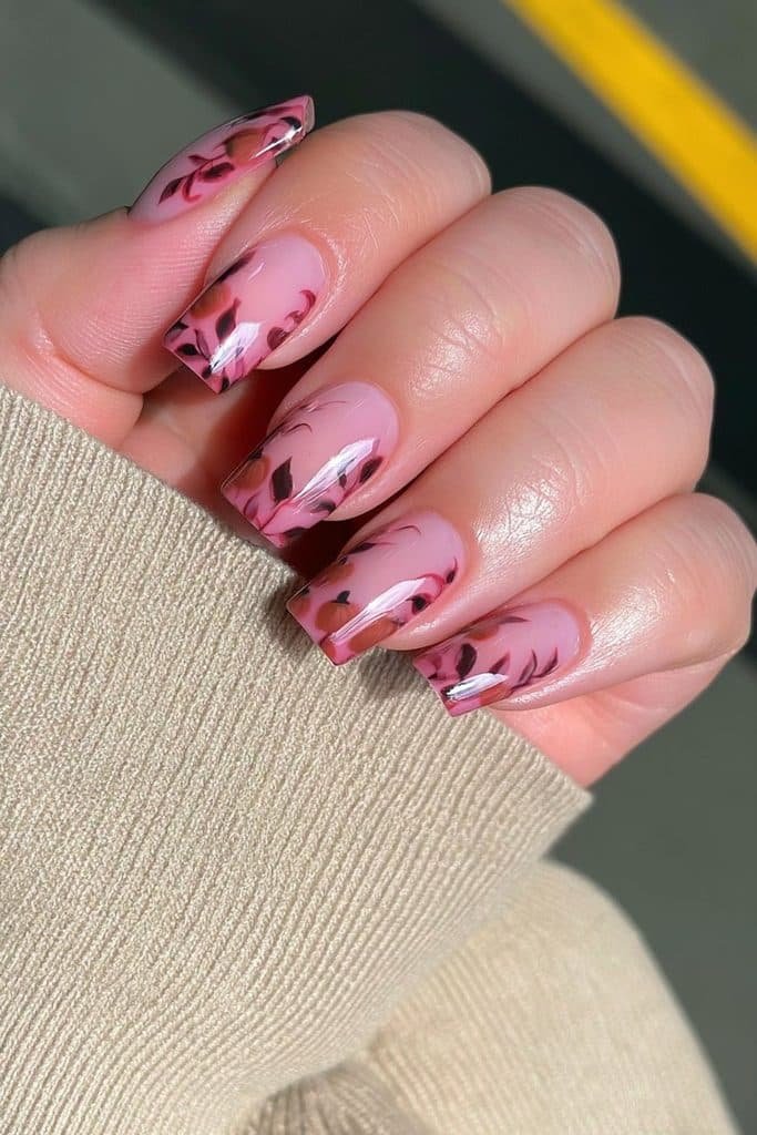 Short squoval Thanksgiving nails with negative-space harvest leaves and tiny pumpkin details.