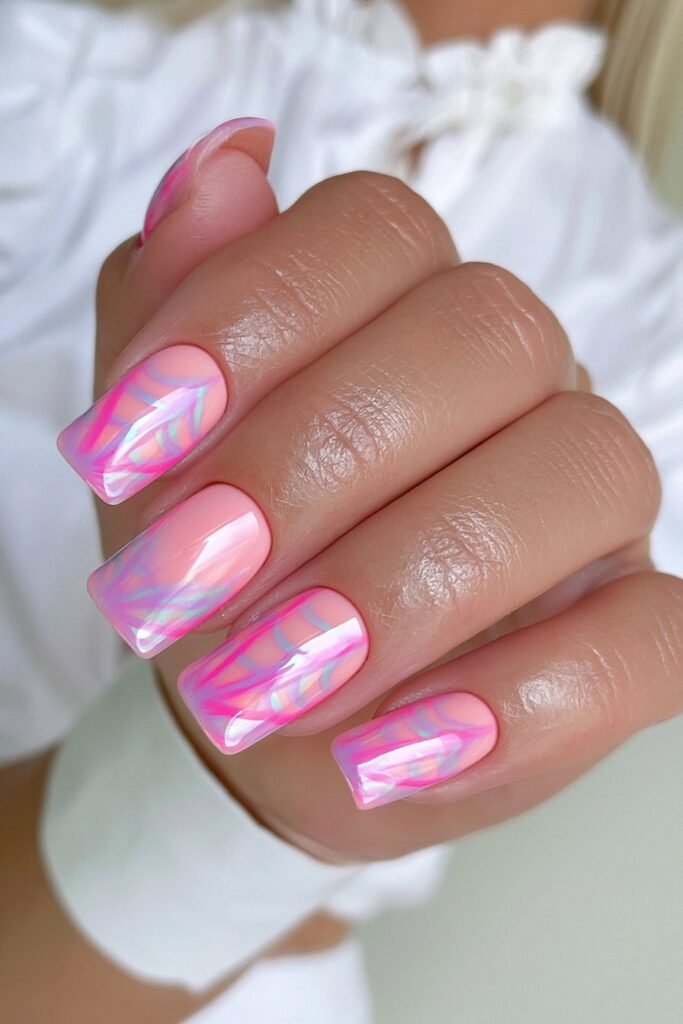 Neon pink square nails with bold spider web artwork.