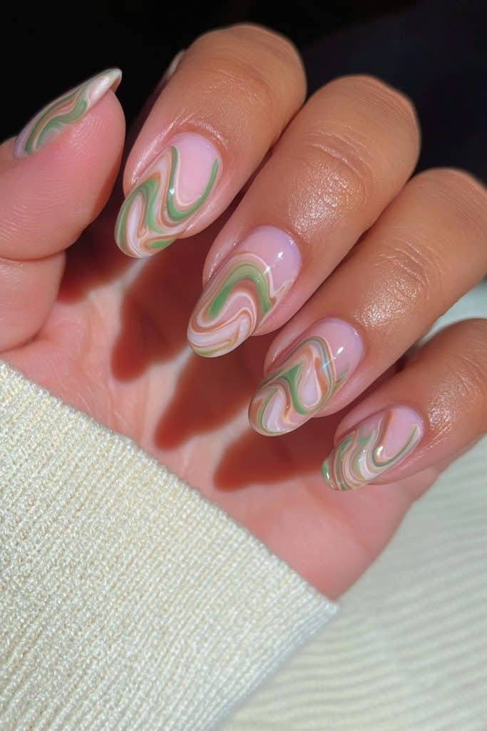 Short oval Thanksgiving nails with elegant olive green and creamy ivory swirls.