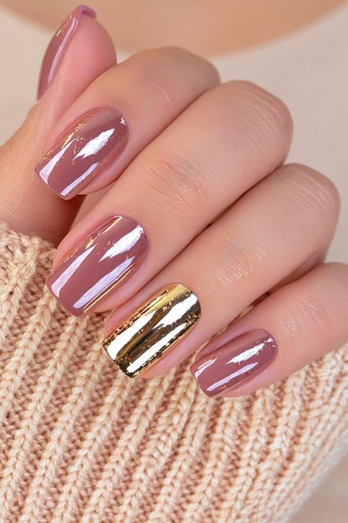 Short squoval chocolate brown Thanksgiving nails with a reflective gold chrome accent nail.