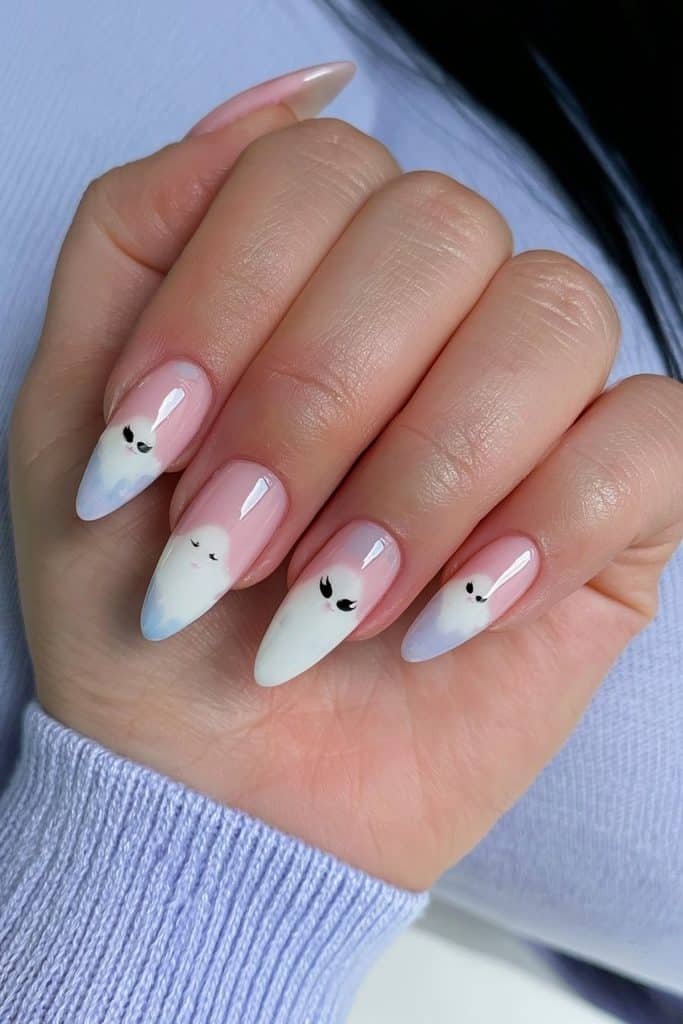 Short pastel almond nails with cute tiny ghost illustrations.