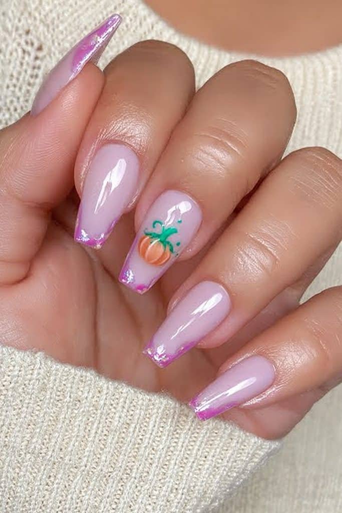 Short pastel lilac nails with a tiny orange pumpkin accent.