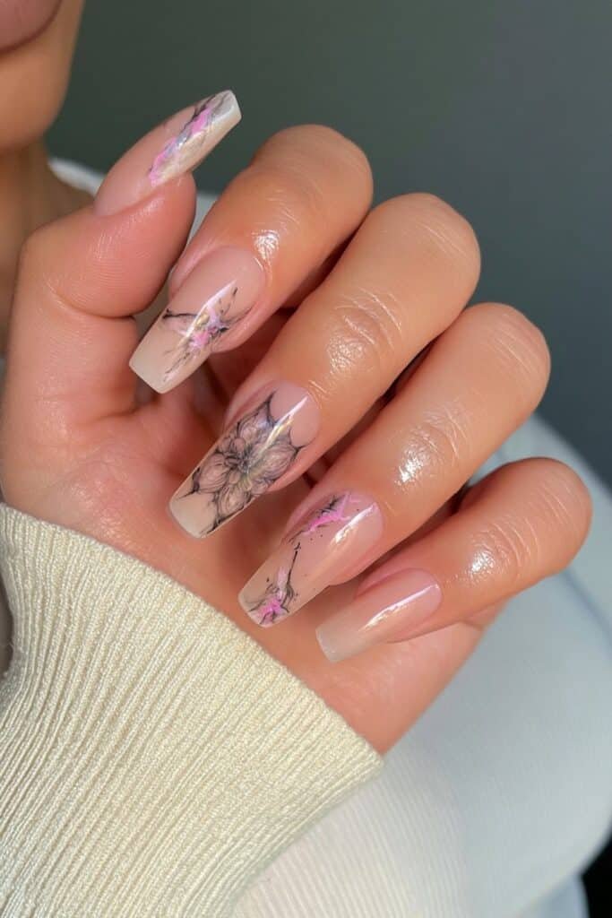 Nude nails with intricate graphite mandala artwork.