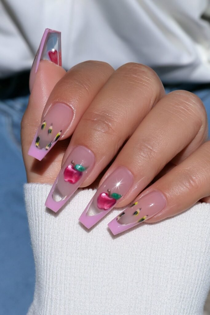 School-themed nails with yellow pencils and red apple accents.