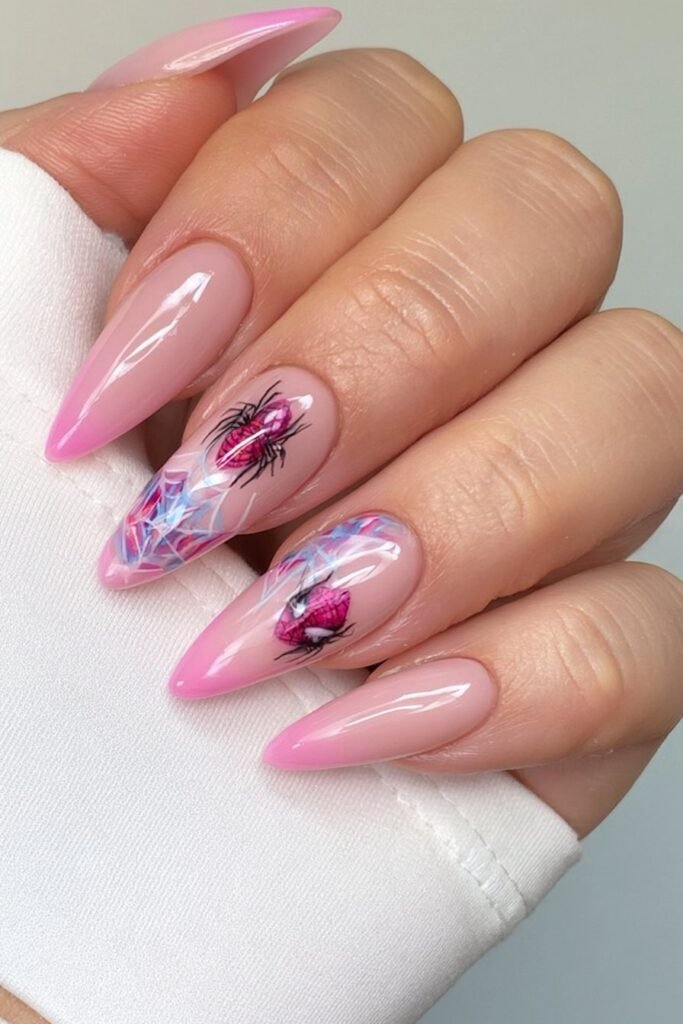 Pink nails with Spider-Man logo and web details.