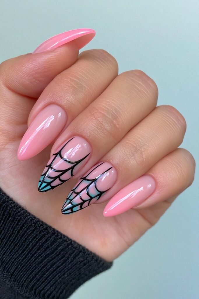 Pink and black gothic nails with spider web patterns.