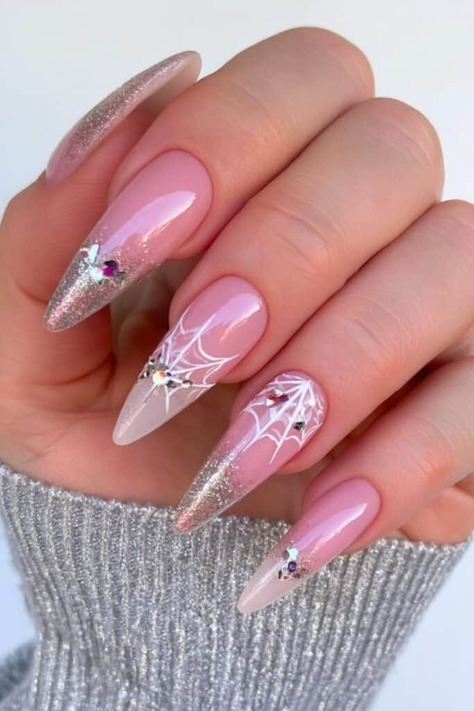 Pink and silver Spiderverse nails with web artwork.