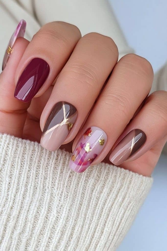 Short oval Thanksgiving press-on nails in cranberry, caramel, chocolate, cream, and gold.