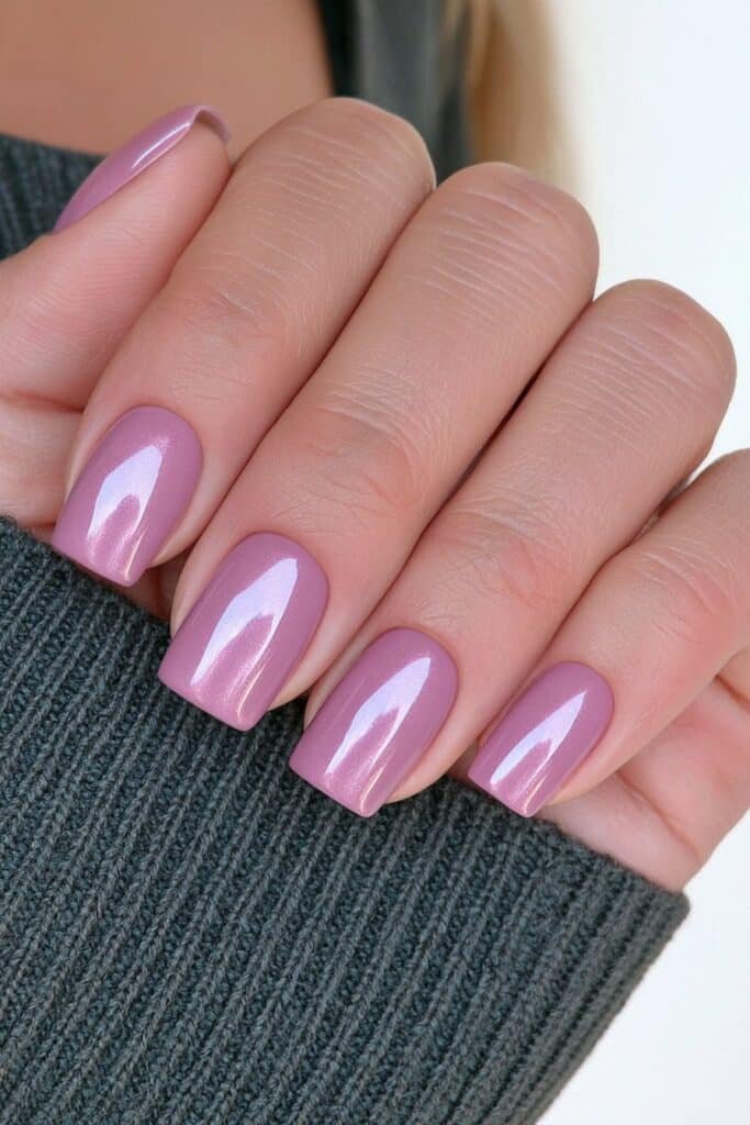 Short purple metallic nails with glossy shine.