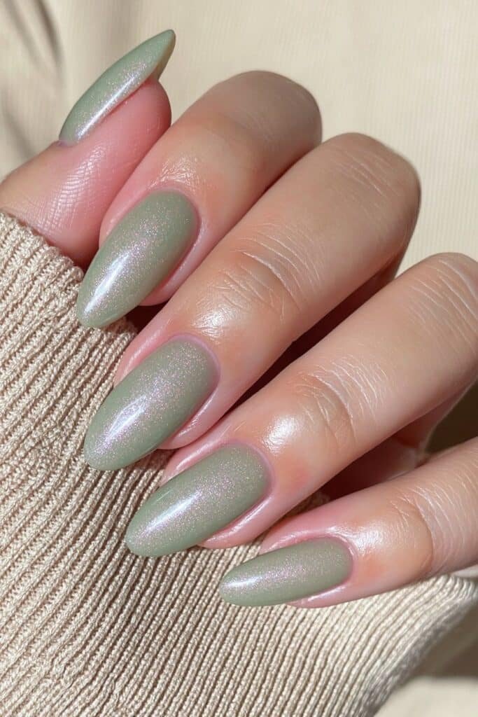 Deep sage green almond nails with rich glossy coverage.