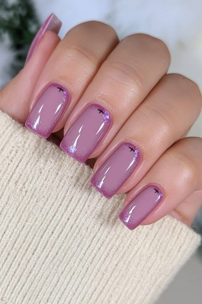 Short square purple nails with minimalist black Halloween accents.