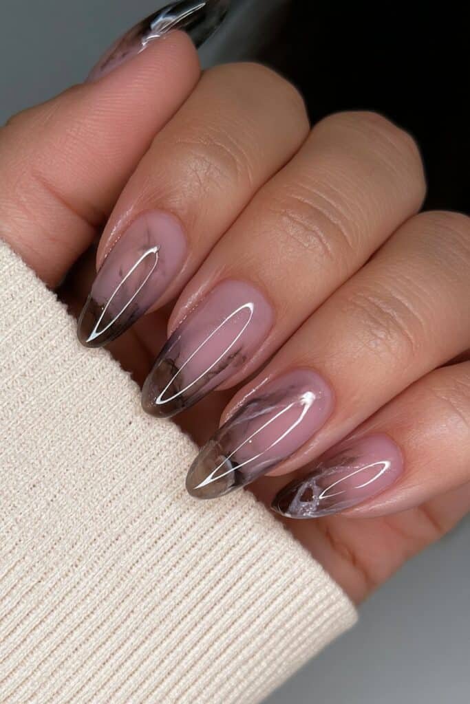 Short almond nails with smoky gray and ivory marble.
