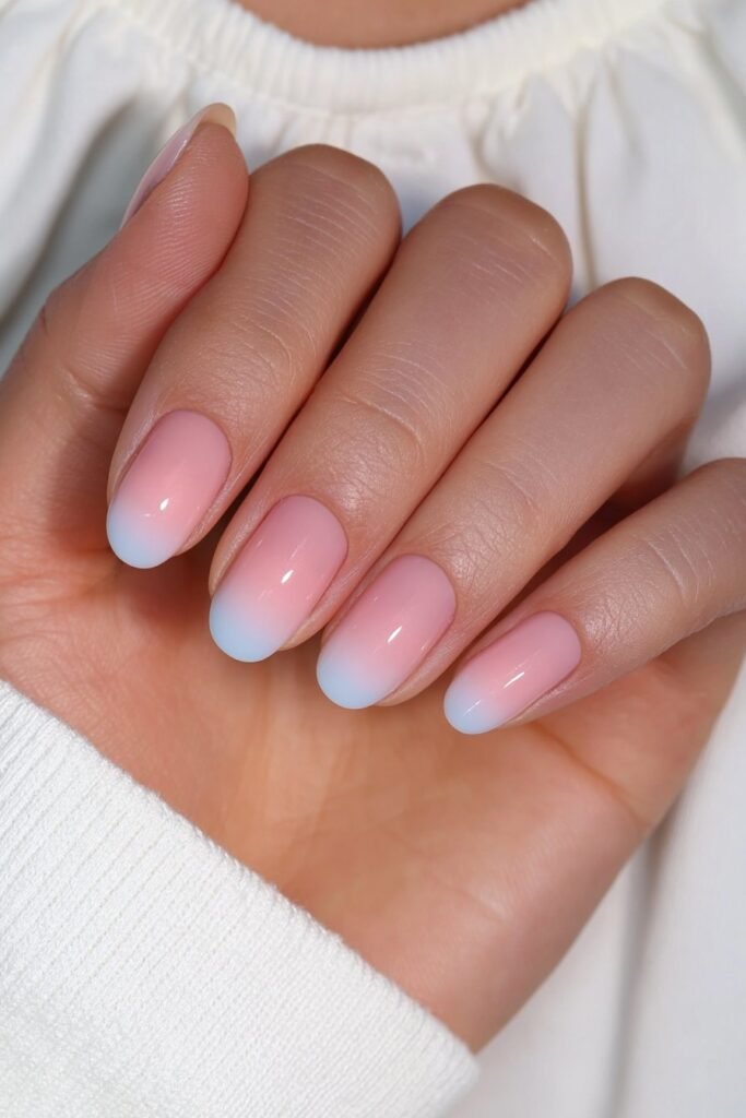 Short blush pink to white ombré nails.