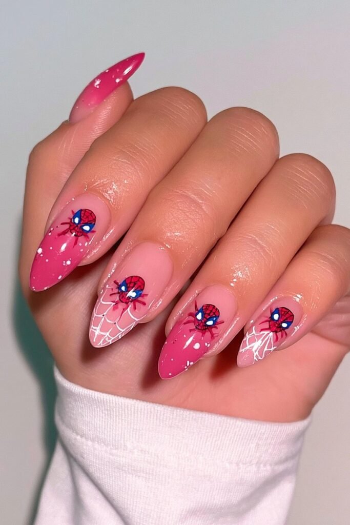 Soft pink Spiderverse nails with webs and comic details.