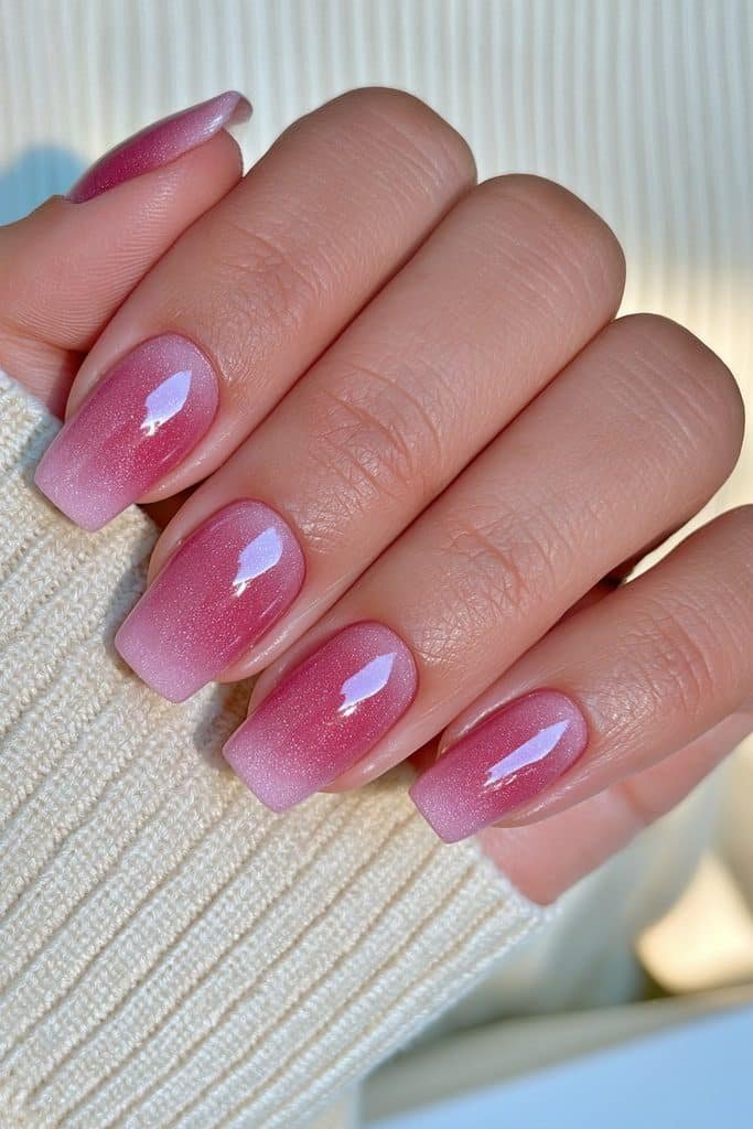 Short oval nails in dusty rose velvet with subtle dimensional shimmer.