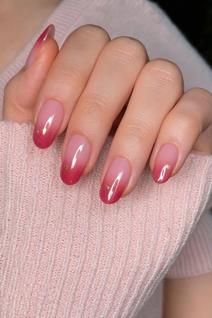 Short squoval nails with pinky nude bases, white French tips, and pearlescent glaze.