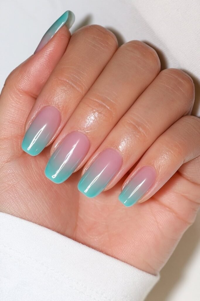 Short turquoise jelly nails with crystal-clear shine.