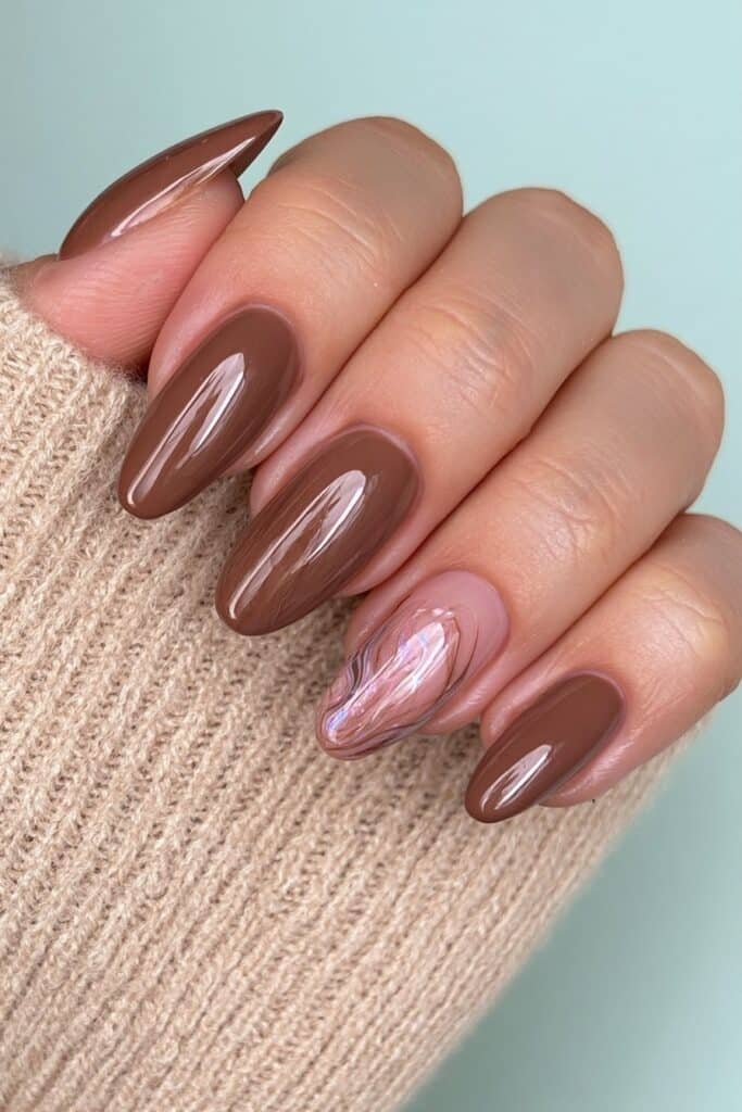 Short almond nails in warm walnut brown with creamy coverage and a glossy finish.