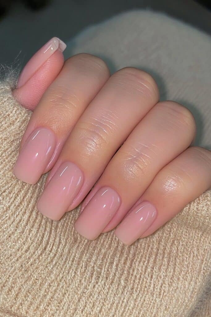 Short warm taupe squoval nails with glossy shine.