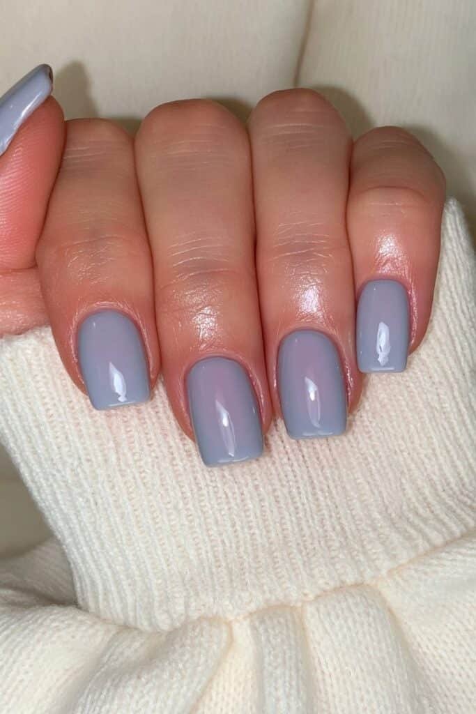 Short washed denim blue nails with glossy shine.
