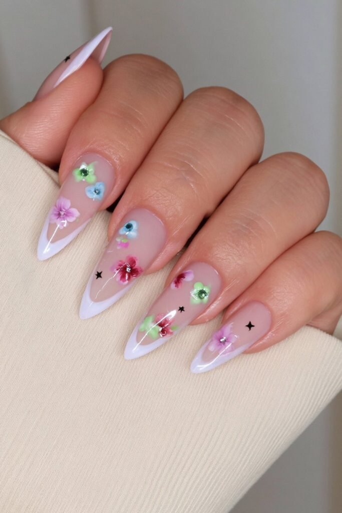 Nude nails with watercolor pencil doodles and school motifs.