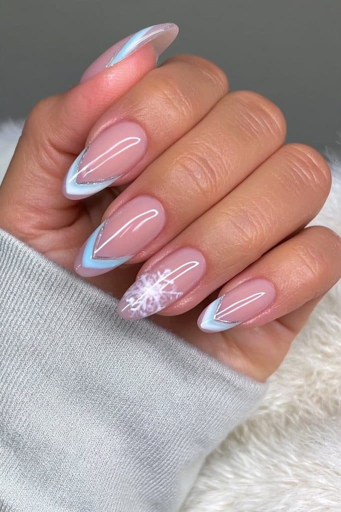Nude nails with angular white and silver snowflakes