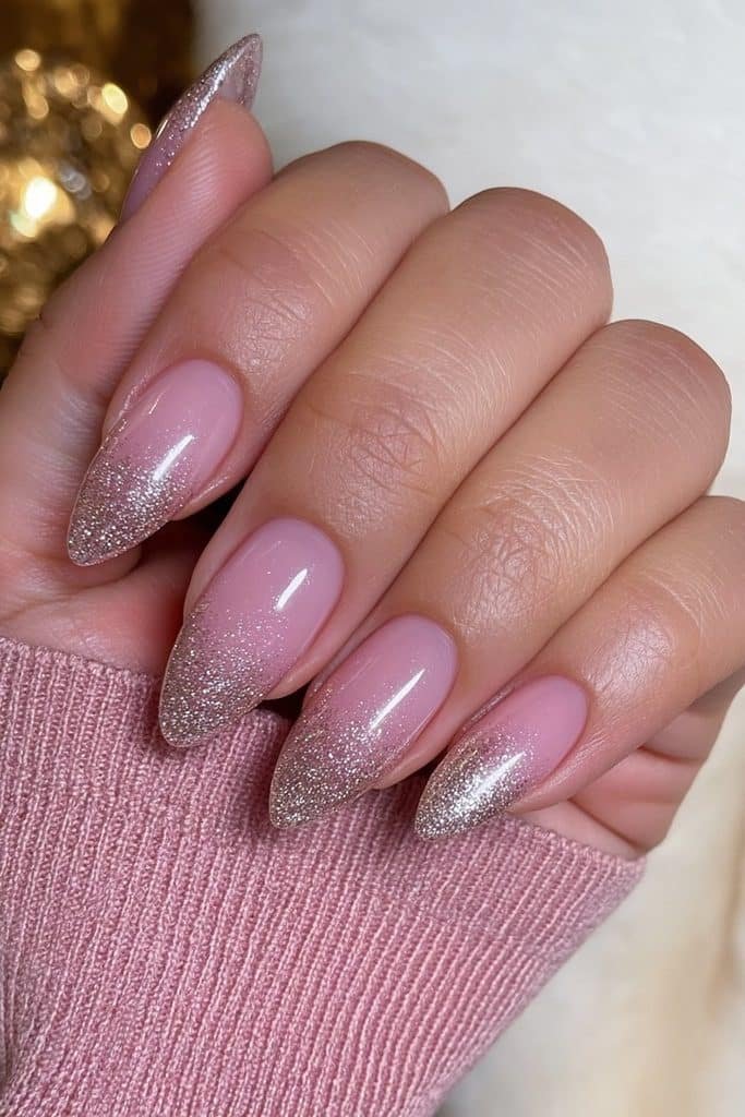 Ballerina pink nails with delicate gold glitter tips