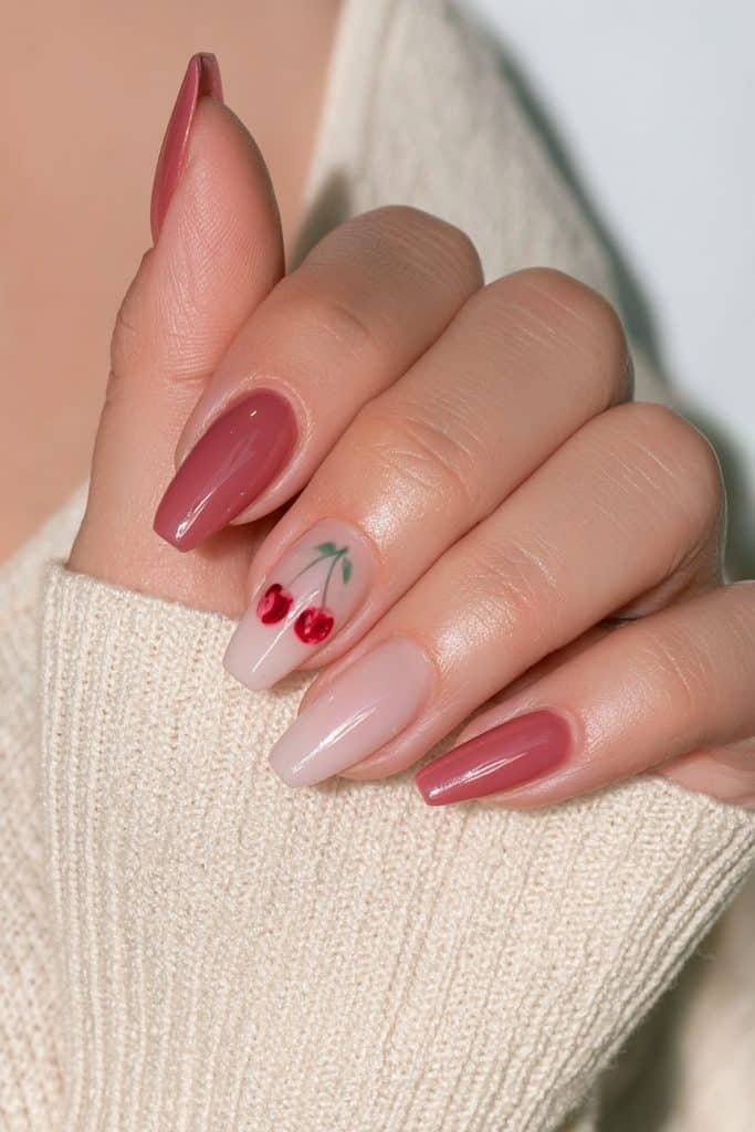 Milky pink coffin nails with a cherry accent