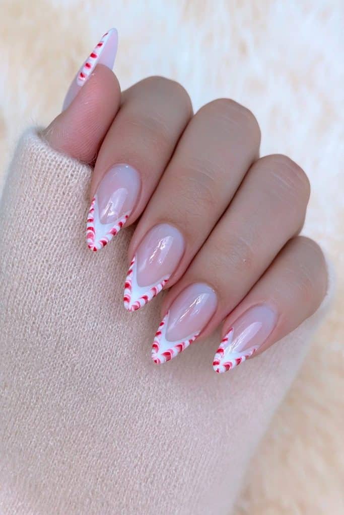 Nude almond nails with red and white chevron tips