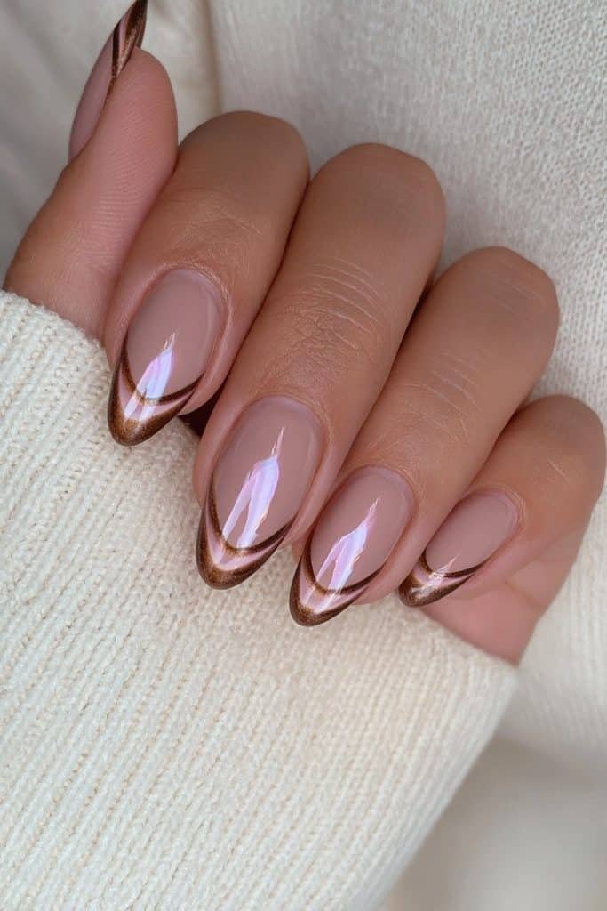 Sheer nude nails with deep chocolate French tips