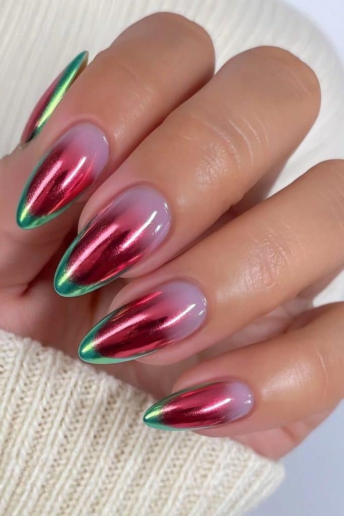 Ruby red chrome nails with emerald foil accents