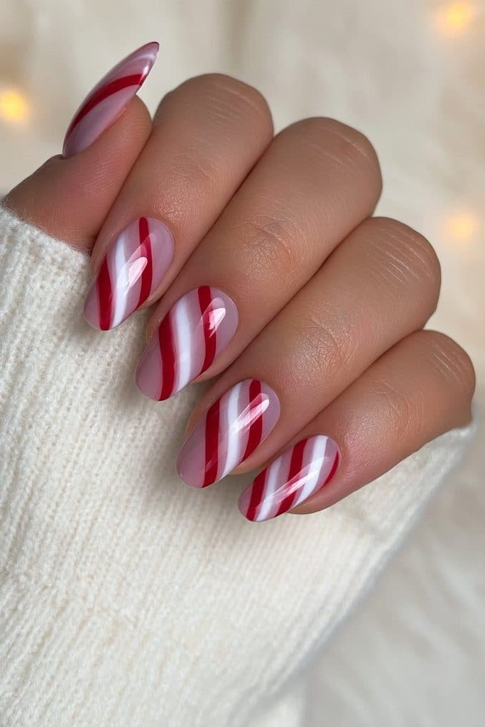 Classic red and white candy cane striped almond nails