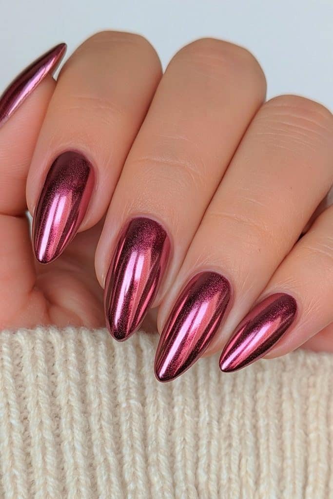 Cranberry red chrome nails with jewel-like shine