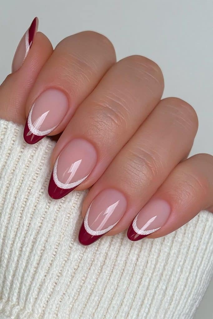 Nude nails with elegant cranberry French tips