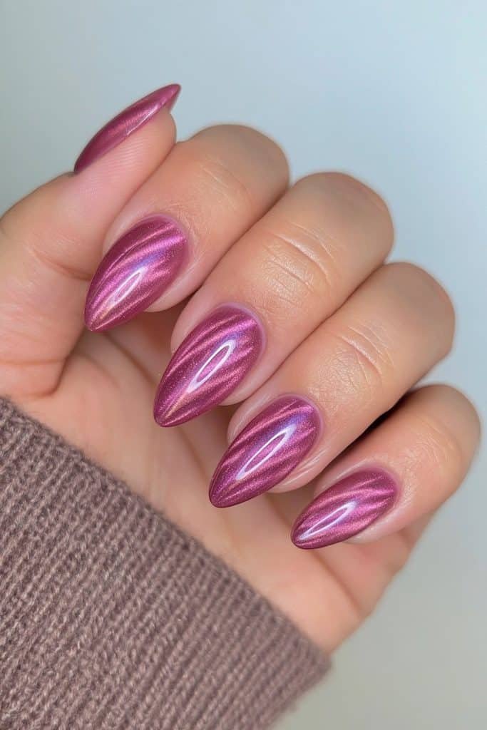 Deep cranberry nails with luminous magnetic stripes