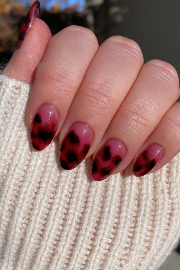 Cranberry nails with warm tortoiseshell accents