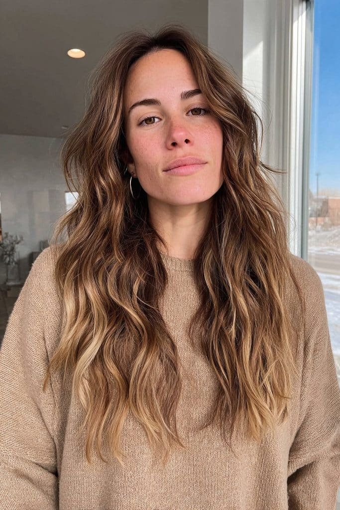 Dark brunette roots melting into creamy chai latte ends
