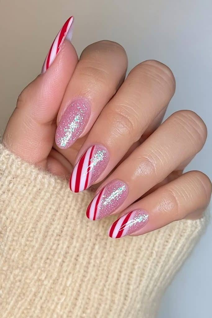 Red and white candy cane nails with fine silver glitter