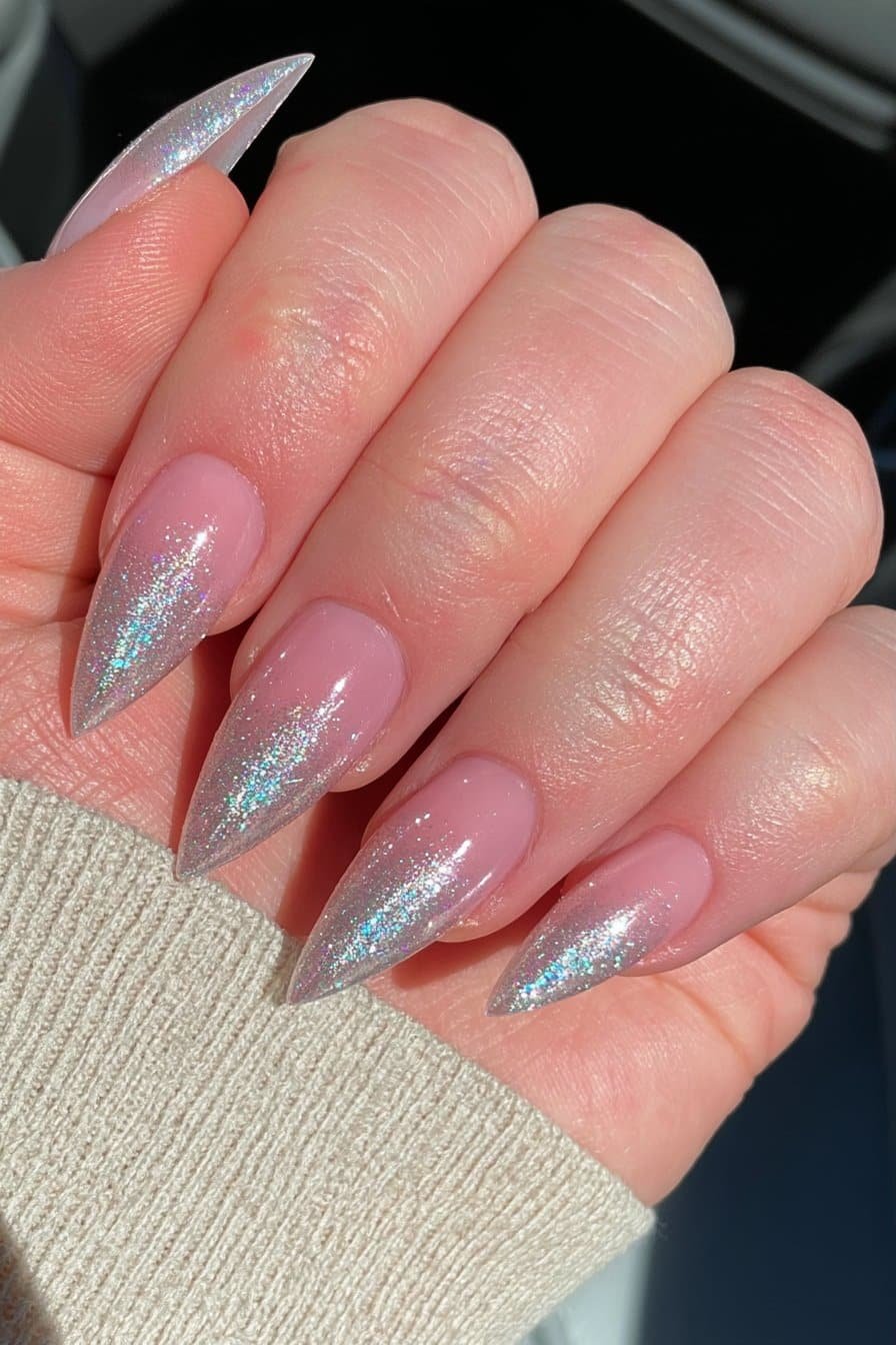 Nude-pink stiletto nails with fine champagne glitter