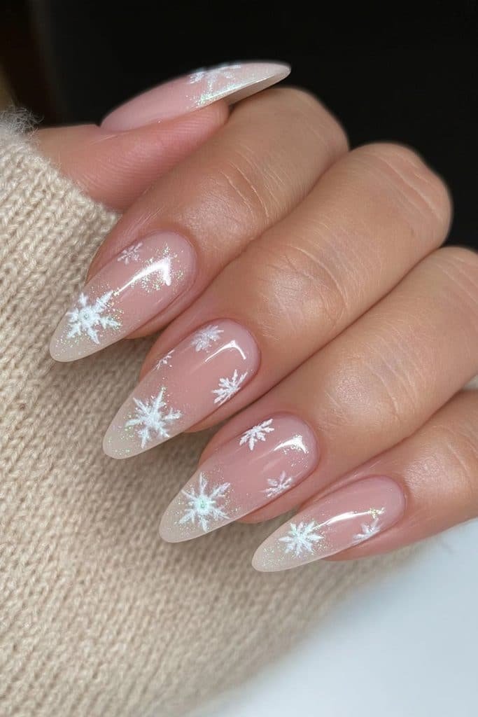 Sheer frosty nails with delicate white snowflakes