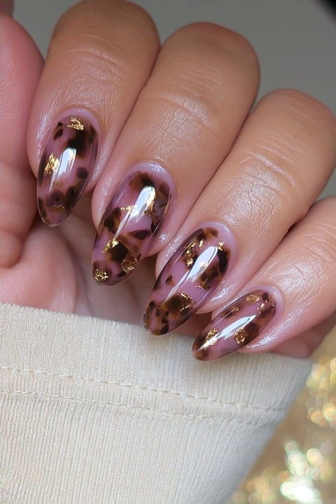 Amber tortoiseshell nails with delicate gold foil accents
