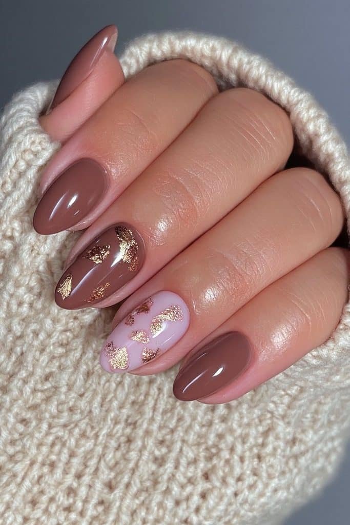 Glossy cocoa nails with delicate gold leaf accents