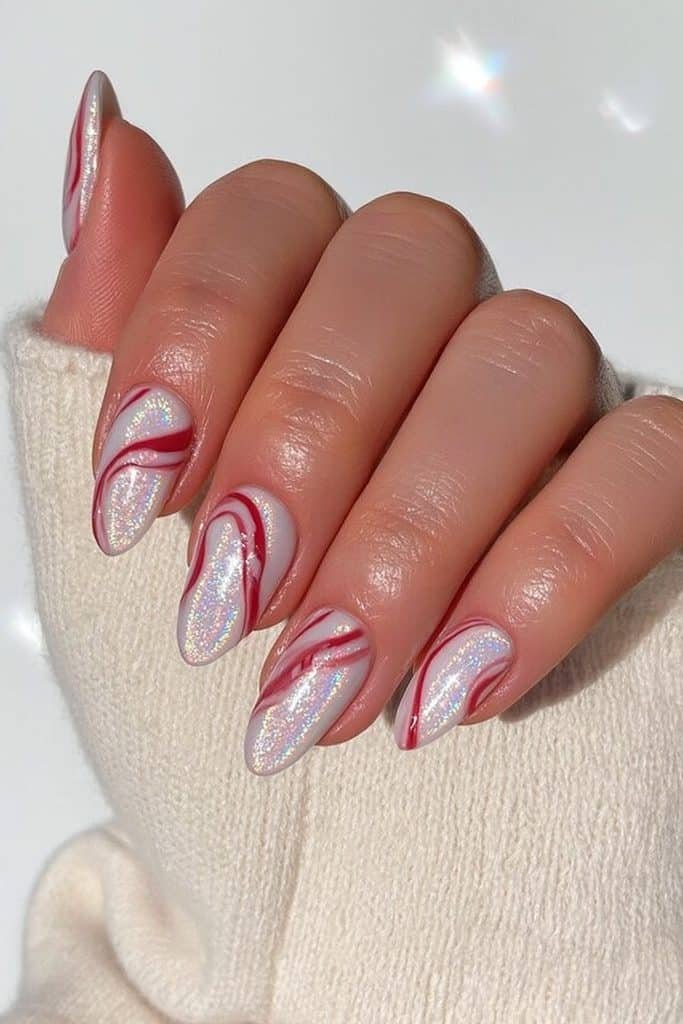 Holographic white nails with glossy red candy cane stripes