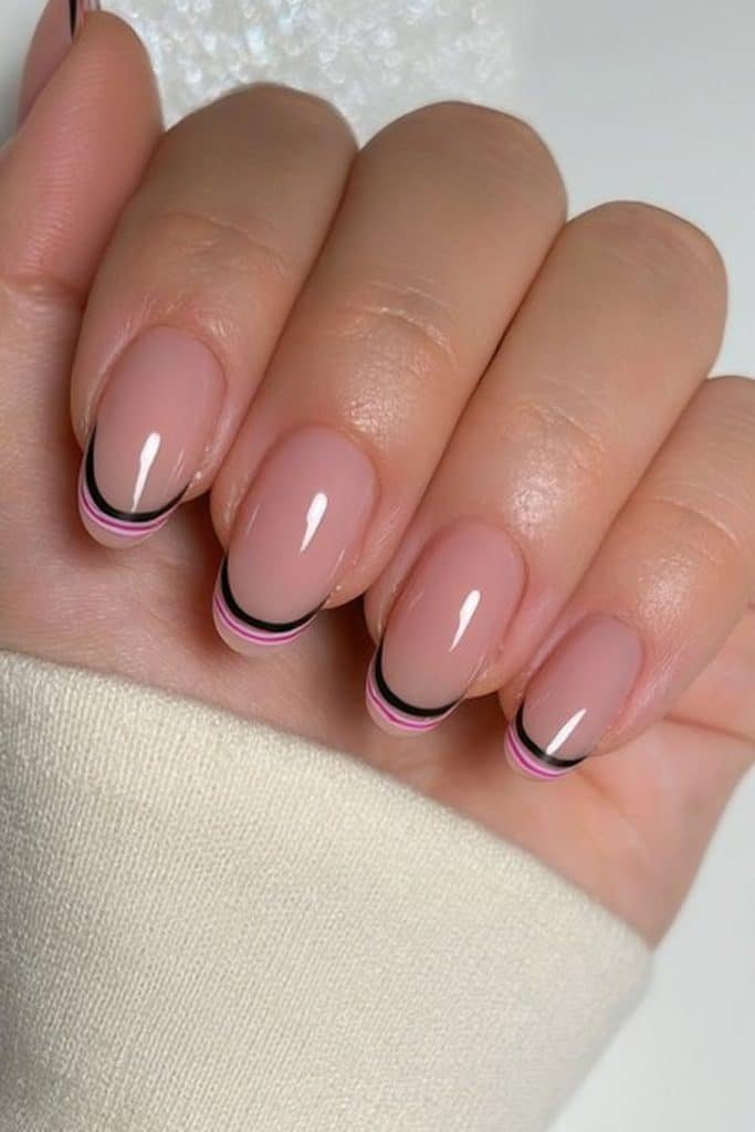 Bare nails with fine red and white candy cane tip stripes