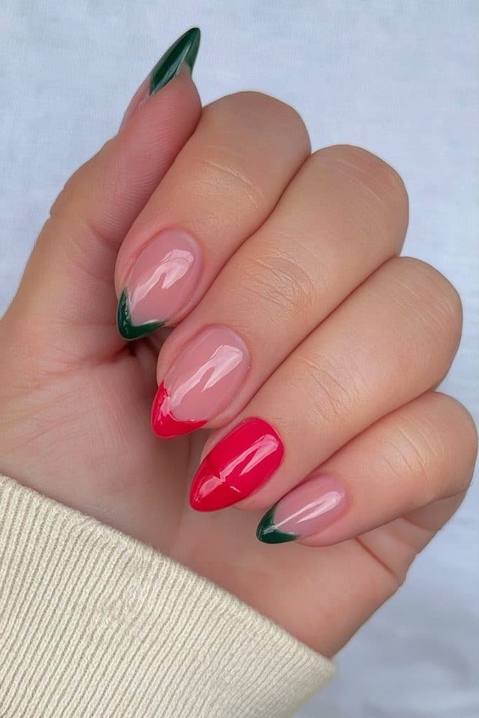 Sheer nude nails with red and green accent nails